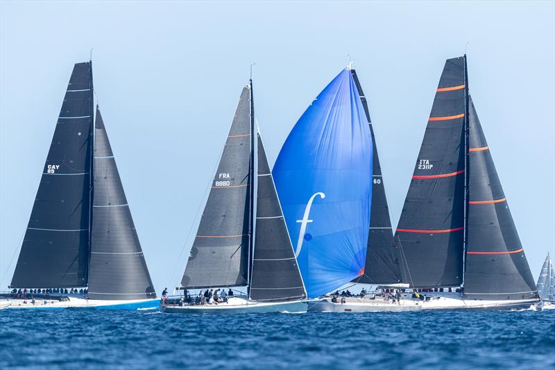 Wallyño, under her blue spinnaker, training today among the maxi fleet photo copyright Gilles Martin-Raget taken at Yacht Club Costa Smeralda and featuring the Maxi class