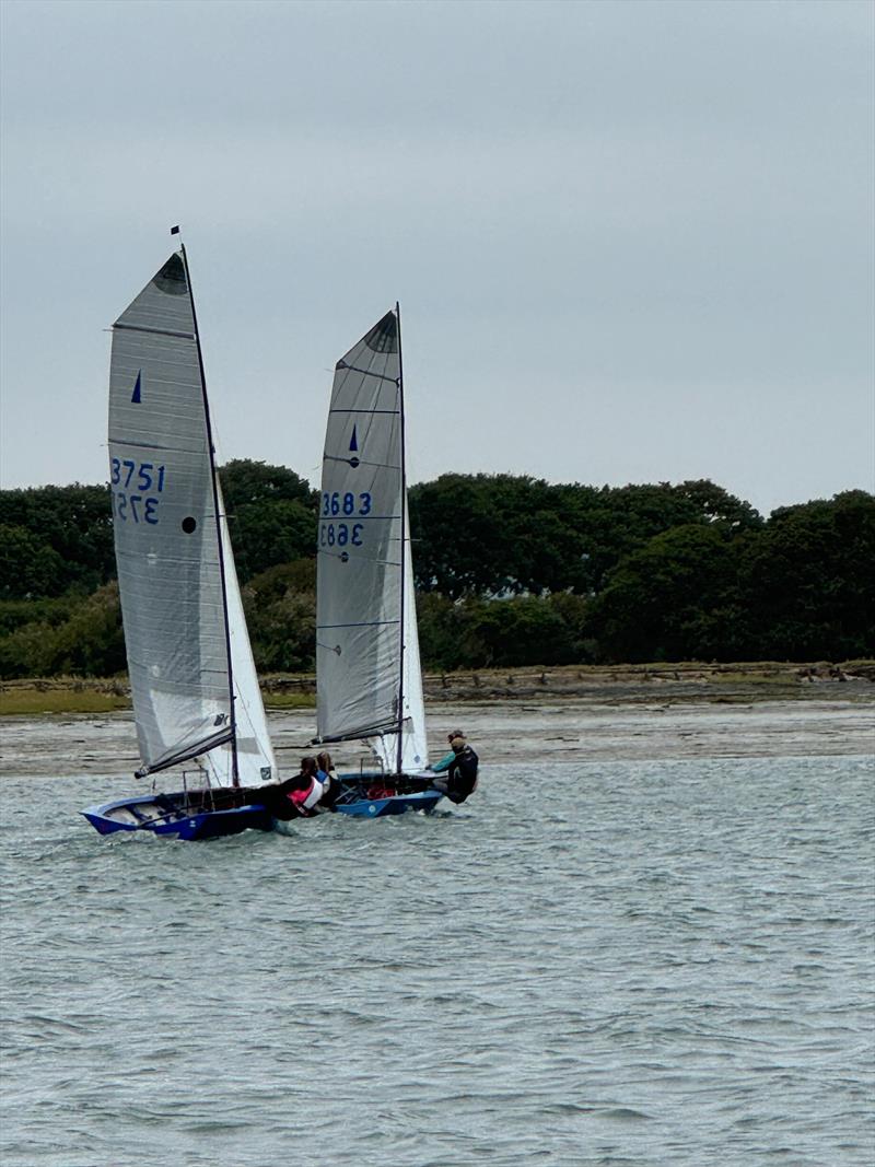 Close racing at the Merlin Rocket Youth Championship at Itchenor Sailing Club photo copyright Sophie Yeoman taken at Itchenor Sailing Club and featuring the Merlin Rocket class