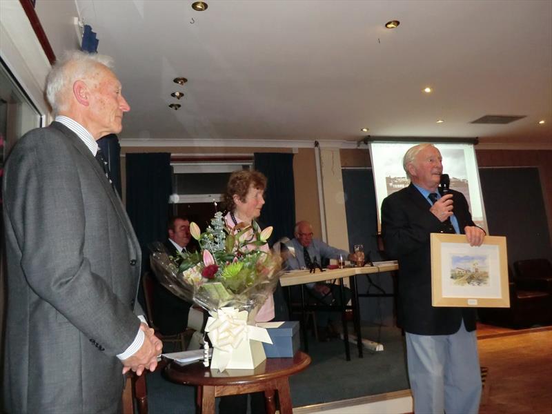 Tony Ayers (left) Doreen England middle with Dave England thanking members photo copyright Rick Napp taken at Torpoint Mosquito Sailing Club