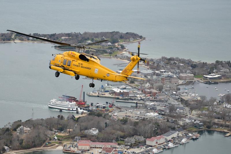 A MH-60 Jayhawk helicopter flies over Woods Hole, Massachusetts, Monday, Dec. 16, 2019. Coast Guard Air Station Cape Cod will celebrate 104 years of aviation in Massachusetts and 50 years on Cape Cod photo copyright Petty Officer 2nd Class Nicole J. Groll taken at 