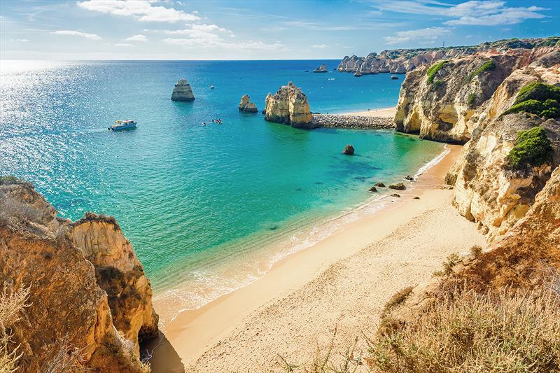 With white sand beaches and rugged, rocky coves, its plain to see why Portugal attracts surfers from all corners of the globe. This one is near Lagos in Ponta da Piedade, Algarve region, Portugal - photo © West Nautical