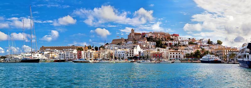 The iconic view of Ibiza old town with gorgeous winding streets, wine, and tapas bars to enjoy traditional Spanish dining - photo © West Nautical