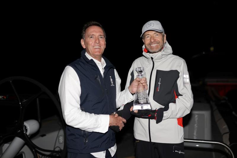 RORC CEO Jeremy Wilton presents Dmitry Rybolovlev, owner of Skorpios with the Monohull Line Honours Trophy photo copyright Arthur Daniel / RORC taken at Royal Ocean Racing Club