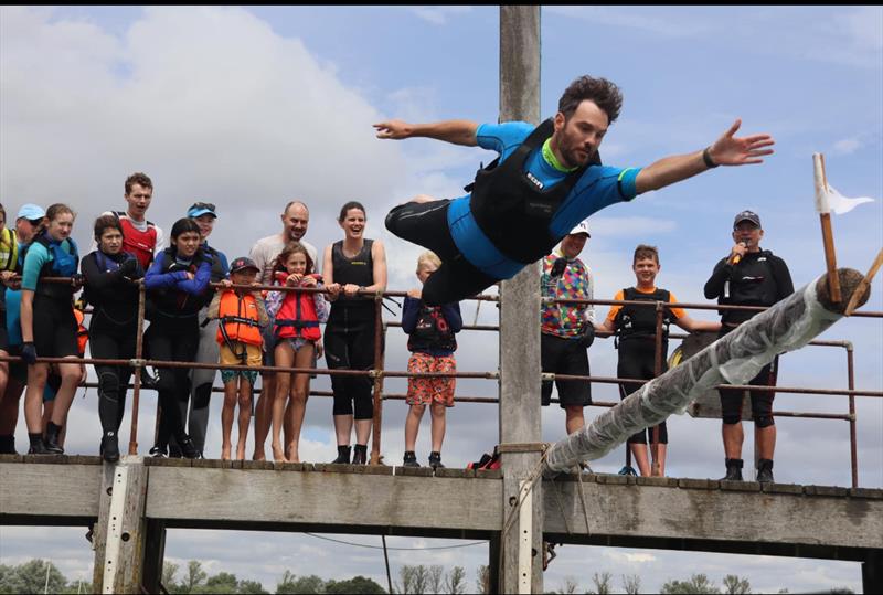 Hugo Berney going for the slippery pole flag at the Blackwater Sailing Club 125th Anniversary Regatta photo copyright Zoe Nelson taken at Blackwater Sailing Club