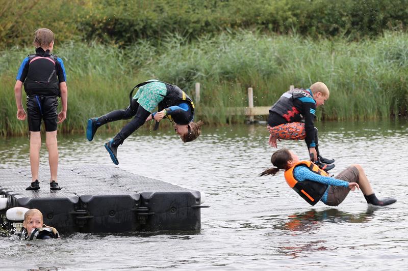 Frollicking off the pontoon during Blackwater Sailing Club Cadet Week - photo © Anna Lau and James Torrance