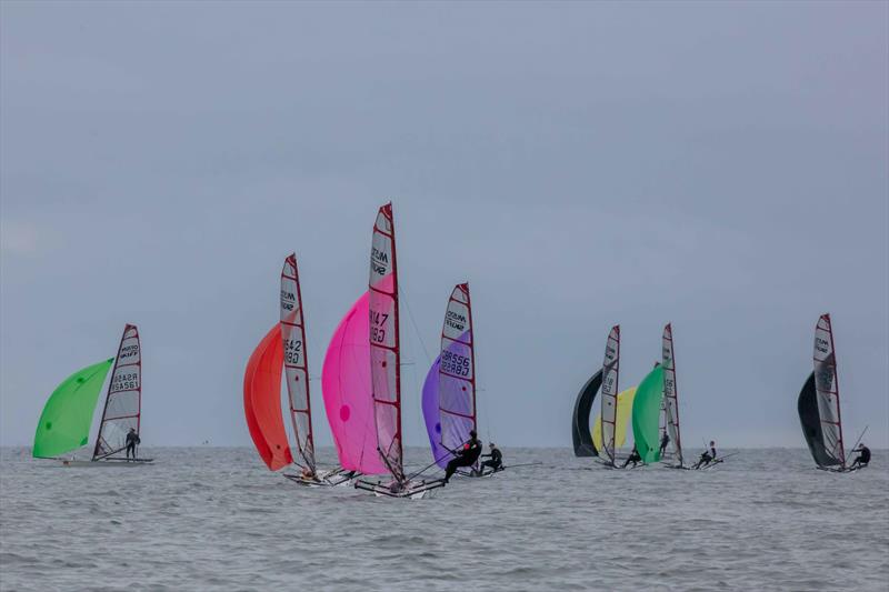 Racing downwind - Noble Marine UK Musto Skiff National Championship 2024 photo copyright Tim Olin / www.olinphoto.co.uk taken at Filey Sailing Club and featuring the Musto Skiff class