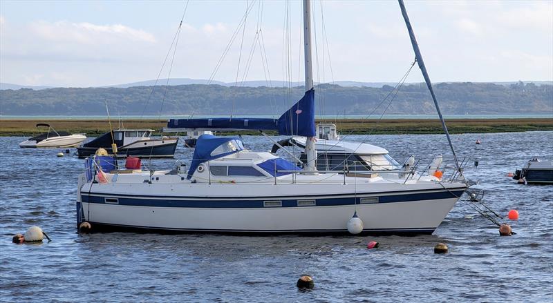 Sails and spray hoods up on mooring present more windage in a storm - photo © Mark Jardine