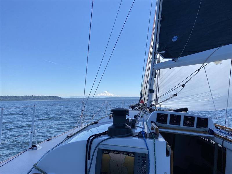 Mount Rainier makes its presence known as Dark Star nears Point Robinson Lighthouse on the 2024 Vashon Island Race photo copyright David Schmidt taken at Seattle Yacht Club and featuring the ORC class