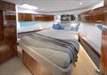 The master forward offers a queen double bed and sweeping hull windows - Riviera 465 SUV