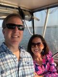 John and Danielle are all smiles in their “happy place” on the Seafarer 226.