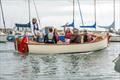 Boat Building Academy students launch their boats in Lyme Regis