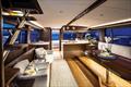 Large opening side and aft windows bathe the salon and aft galley in natural light, and ventilation