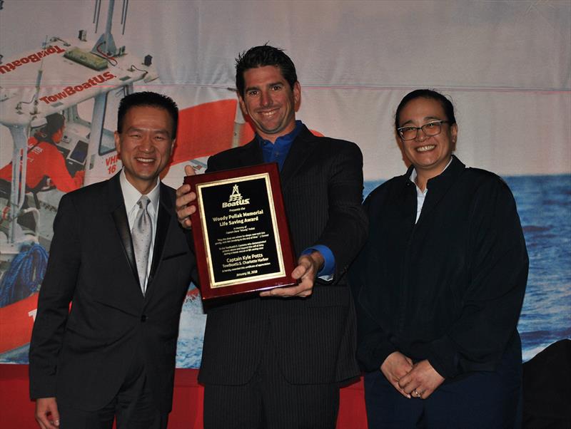 (L to R) BoatUS Chairman and CEO Kirk La, one of the four Woody Pollack Award winners Capt. Kyle Potts of TowBoatUS Charlotte Harbor, Florida, and Captain Christina M. Davidson, US Coast Guard Office of Search and Rescue photo copyright BoatUS taken at  and featuring the Power boat class