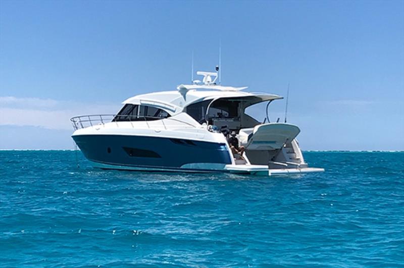 Wire Less at anchor in the Whitsundays photo copyright Riviera Australia taken at  and featuring the Power boat class