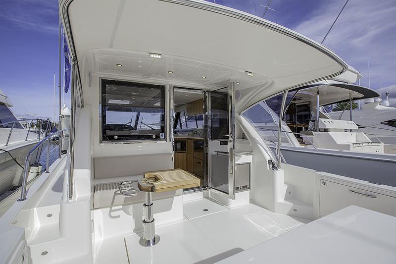 Riviera's 395 SUV enjoys all the modern amenities from al fresco dining to ice maker and joystick control. The cockpits is a delight from any angle and super versatile! photo copyright John Curnow taken at  and featuring the Power boat class