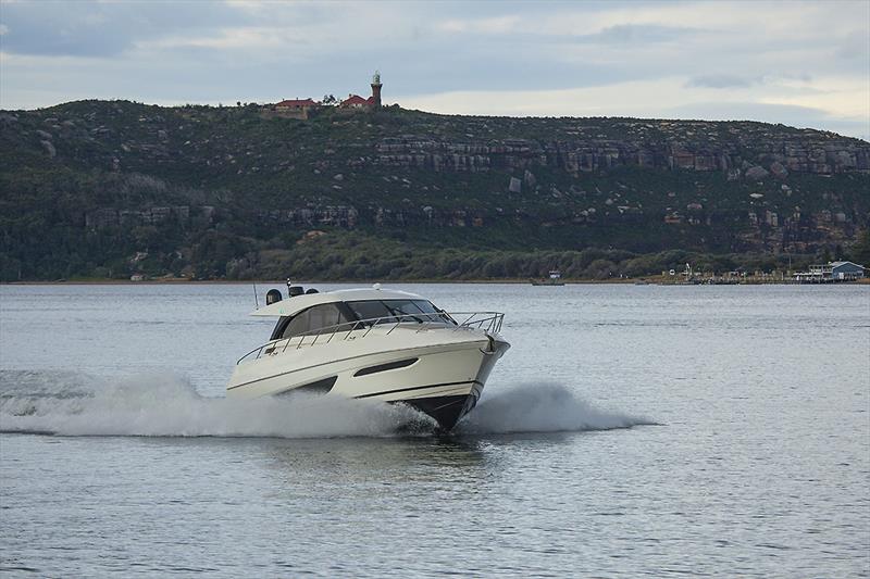 Charging back up Pittwater under the watchful eye of Barrenjoey Light. Flat water like this and the X50 will do 27 knots all day long. - photo © John Curnow