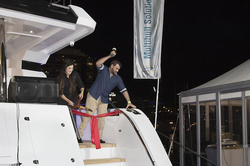 Christening the new ILIAD 70 at the Sydney international Boat Show - that Champagne bottle was not going to need a second attempt!!! - photo © John Curnow