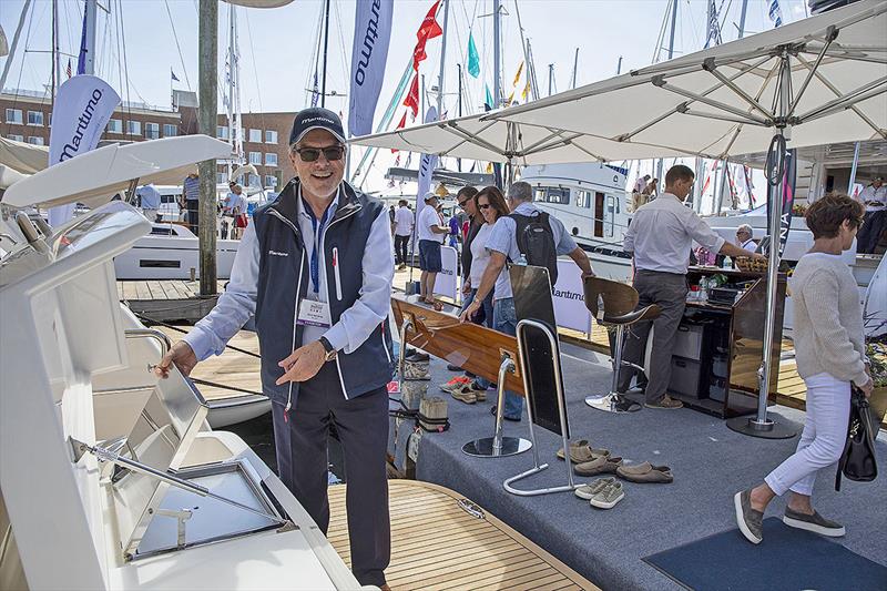 Maritimo America's President, Dave Northrop, proudly displaying the vessels at the Newport show - photo © Billy Black