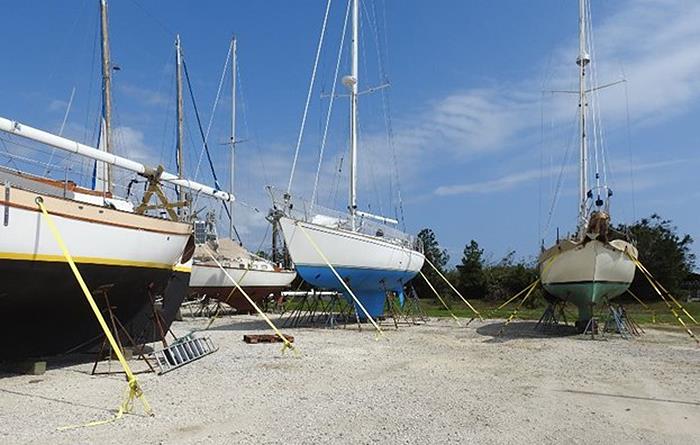 Tieing vessels firmly to the ground helped these three vessels, located at Penscola Shipyard in Pensacola, Florida, weather Hurricane Sally's 105 mph winds. - photo © Scott Croft