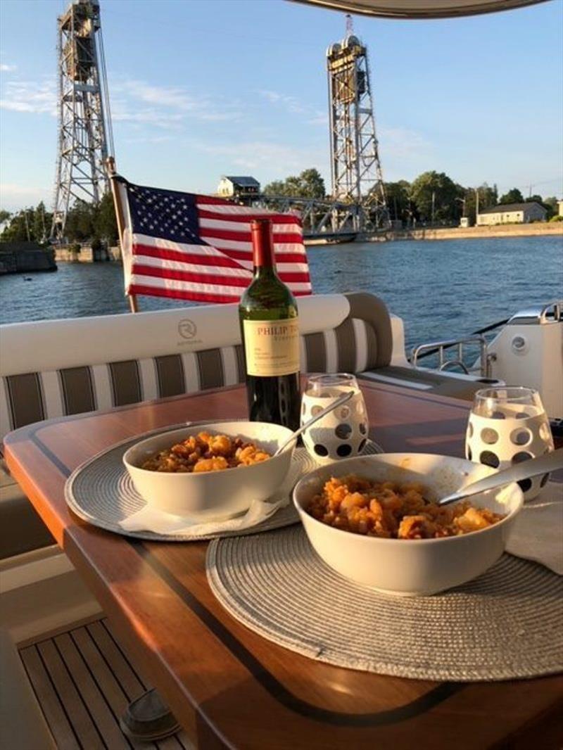 Dinner with the Welland Canal in the background, leaving Lake Erie and into Lake Ontario - photo © Riviera Australia