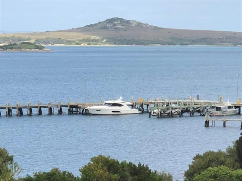 Rayzaway in the port of Lady Barron on Flinders Island photo copyright Riviera Australia taken at  and featuring the Power boat class