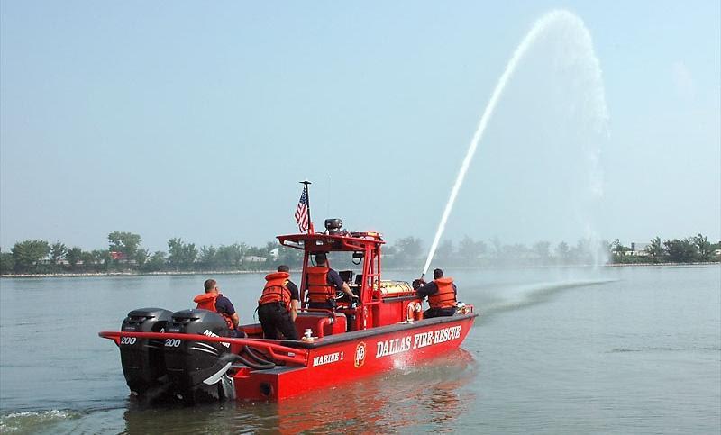 Customized fire boats photo copyright US Watercraft taken at  and featuring the Power boat class