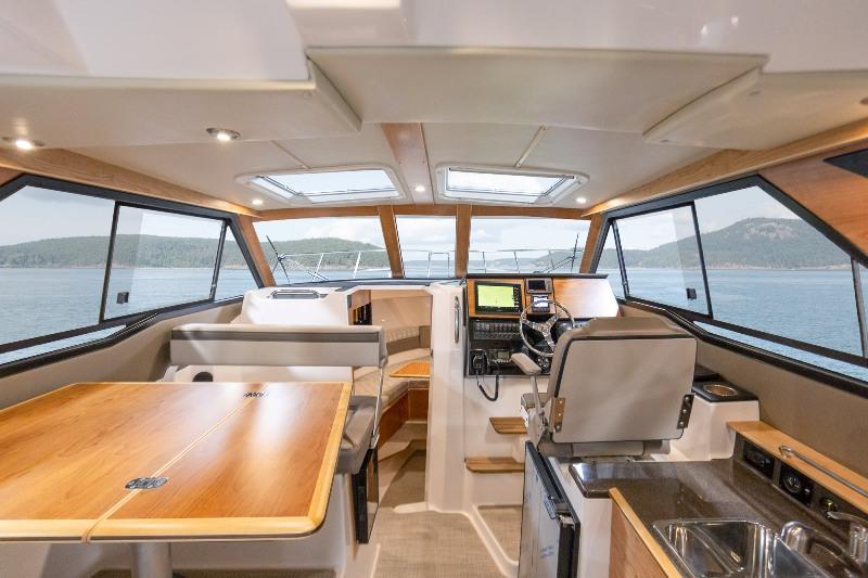 Inside the salon, you will notice the all-round visibility afforded by the large windows and enhanced sliding hatches. - photo © Cutwater Boats
