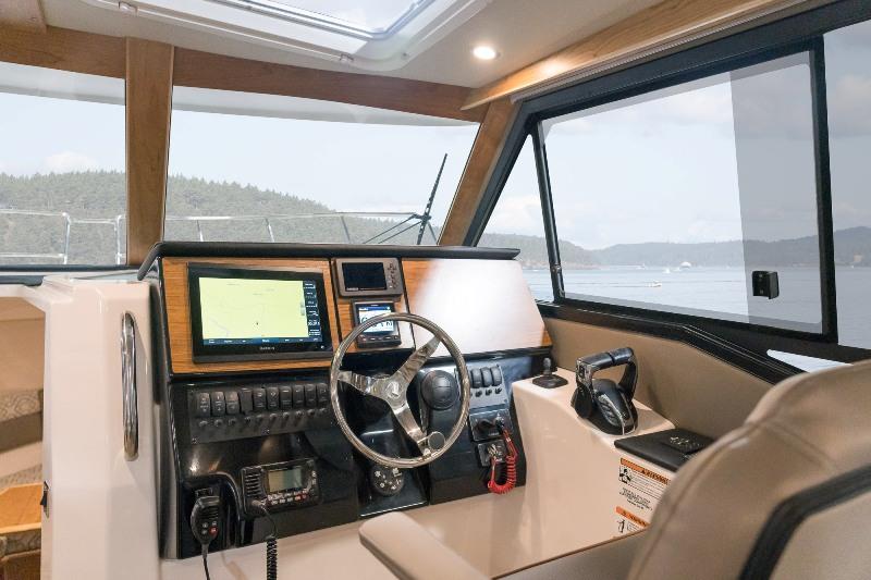 The helm provides the ultimate control with the latest Yamaha outboard throttles, and a Garmin 8612xsv chartplotter. - photo © Cutwater Boats