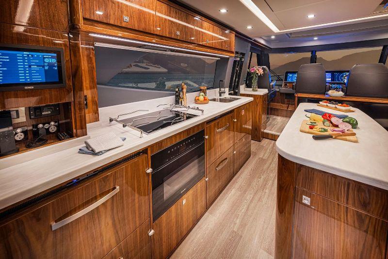 Aft galley with island bench, make the most of the grand scale afforded by Riviera's flagship SUV. - photo © Riviera Australia