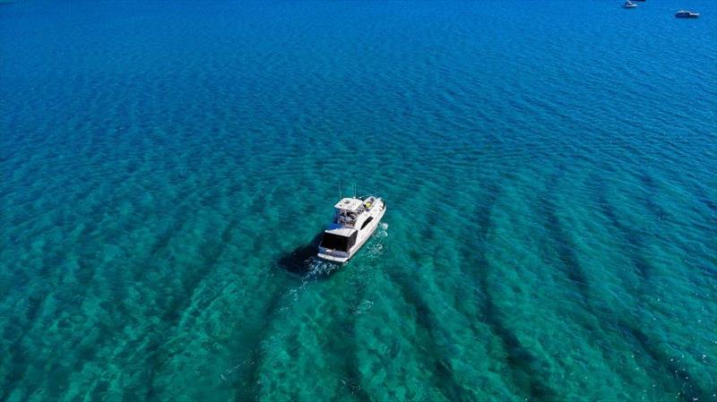 The sunsets and the location on a fantastic day of boating enjoyment and camaraderie for motor yacht owners, their families and friends at Fraser Island. - photo © Riviera Australia