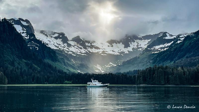 Impulse with a ray of sun - 2022 Slowboat Flotilla to Alaska photo copyright Laura Domela taken at  and featuring the Power boat class