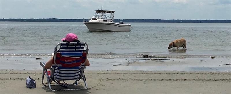 Danielle relaxes on the beach reflecting on the next adventures to be had on the Seafarer 226. - photo © Grady-White