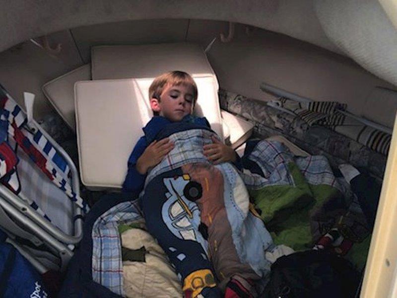 The Troutman boys loved napping in the cabin of their Seafarer 226! On this rare occasion, Henry slept soundly with the cabin all to himself. - photo © Grady-White