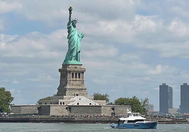 ANNE MARIE cruising by one of America's most famous landmarks - the Statue of Liberty photo copyright Outer Reef Yachts taken at  and featuring the Power boat class
