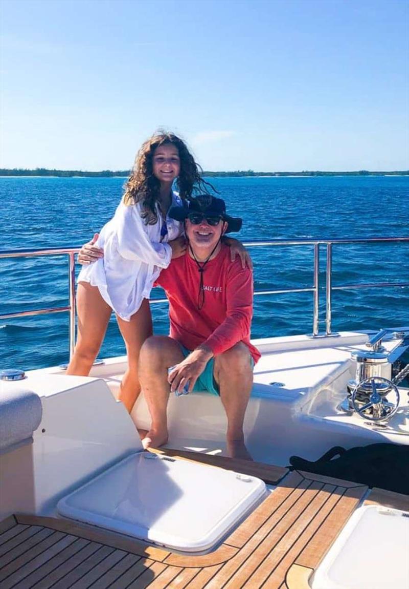 Chuck and Piper on the foredeck of Sandpiper, anchored off Nassau in The Bahamas photo copyright Riviera Australia taken at  and featuring the Power boat class