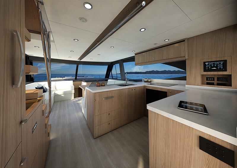 The gourmet galley has a full height refrigerator and features premium appliances beautifully integrated into handcrafted exotic timbers - photo © Riviera Studio