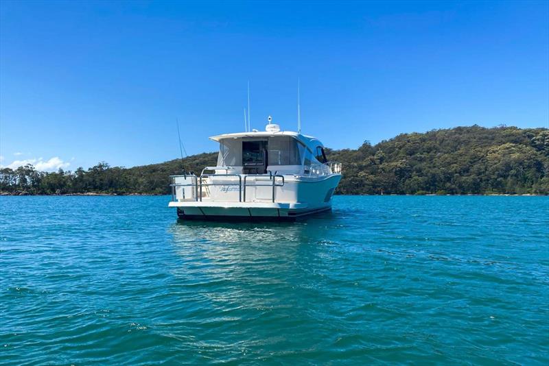 Riviera 505 SUV Taylor Made and her crew enjoying the serenity of being at anchor - photo © Riviera Australia