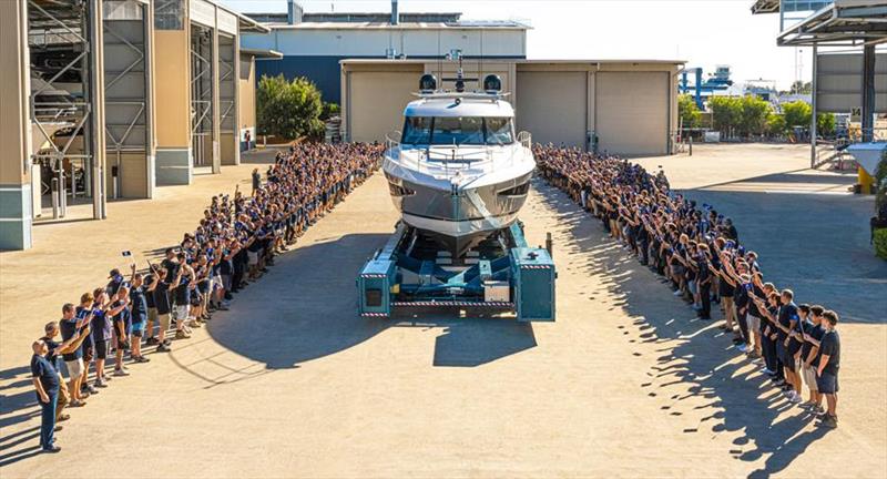 The Riviera team celebrate the launch of their 6,000th motor yacht - photo © Riviera Australia
