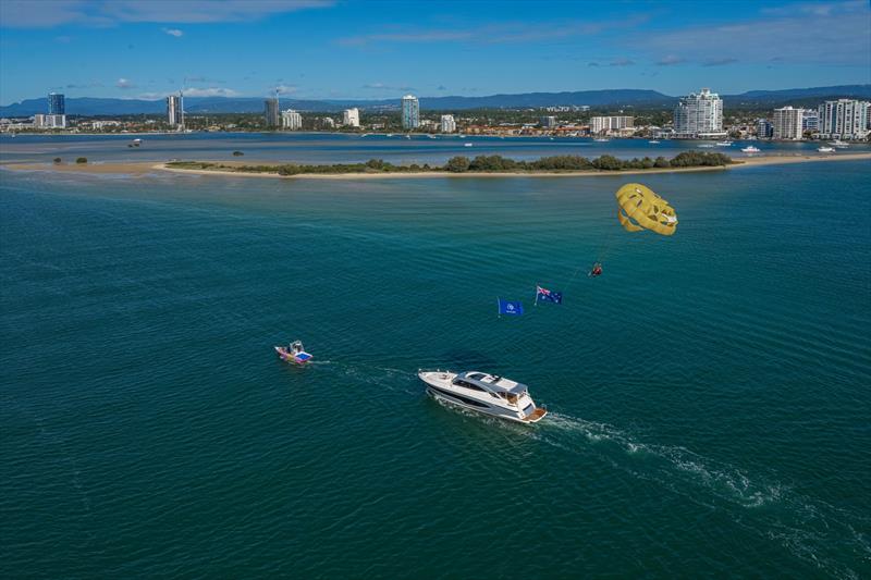 Riviera apprentices Luke Burgess and Laura Hillman took to the skies over the Gold Coast waterways to celebrate the launch of the luxury motor yacht builder's new 6800 Sport Yacht Platinum Edition - photo © Riviera Australia