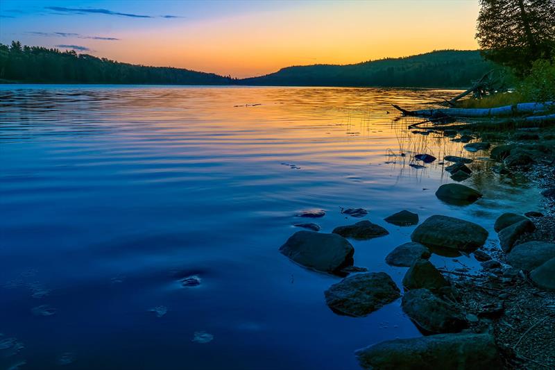 The sunrise scenery at Three Mile Campground at Isle Royale National Park is certainly worth getting up early for photo copyright Riviera Australia taken at  and featuring the Power boat class