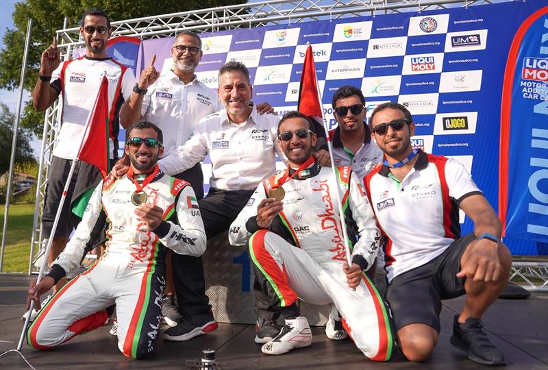 Rashed Al Qemzi and Mansoor Al Mansoori  with Team Abu Dhabi manager Guido Cappellini and other team-mates - photo © Narayan Marar