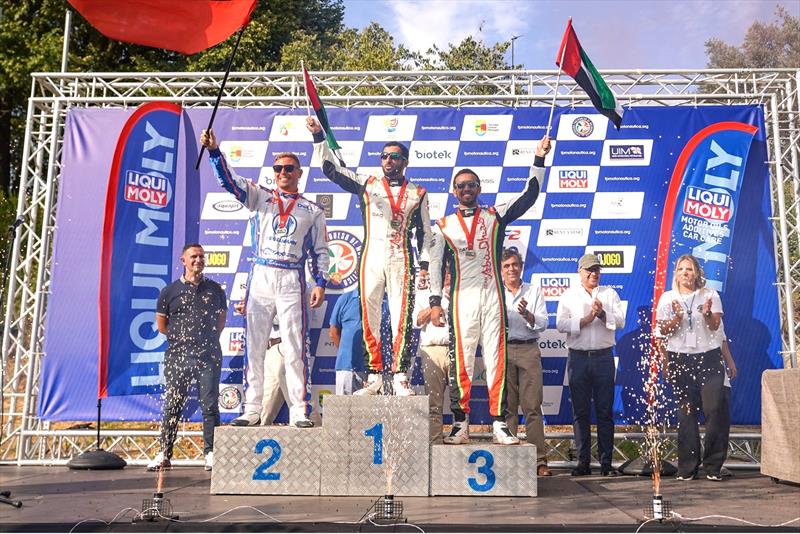 Rashed Al Qemzi and Mansoor Al Mansoori on the championship podium with Lithuania's Edgaras Riabko photo copyright Narayan Marar taken at  and featuring the Power boat class