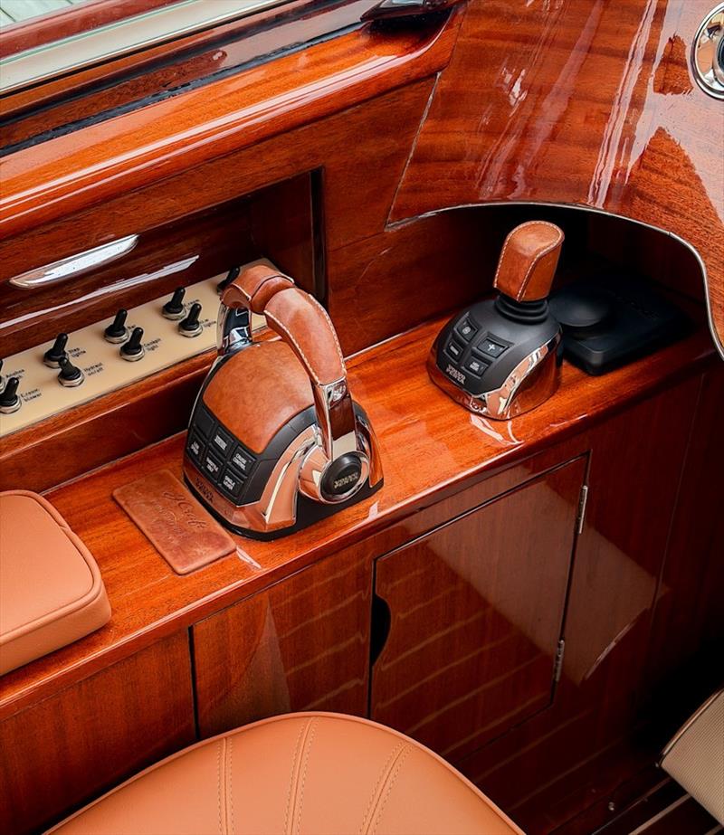 Chrome, marine leather, teak and mahogany at the cockpit controls - photo © J Craft Boats