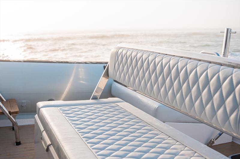 Seating with custom diamond stitched design - photo © Protector Boats