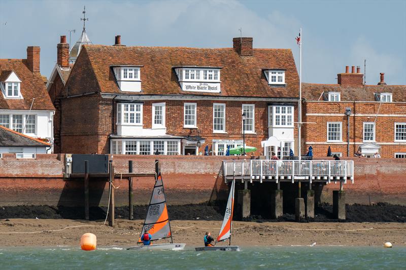 RS Tera sailing in front of the White Harte Hotel during Burnham Week 2024 photo copyright Petru Balau Sports Photography / sports.hub47.com taken at Royal Corinthian Yacht Club, Burnham and featuring the RS Tera class