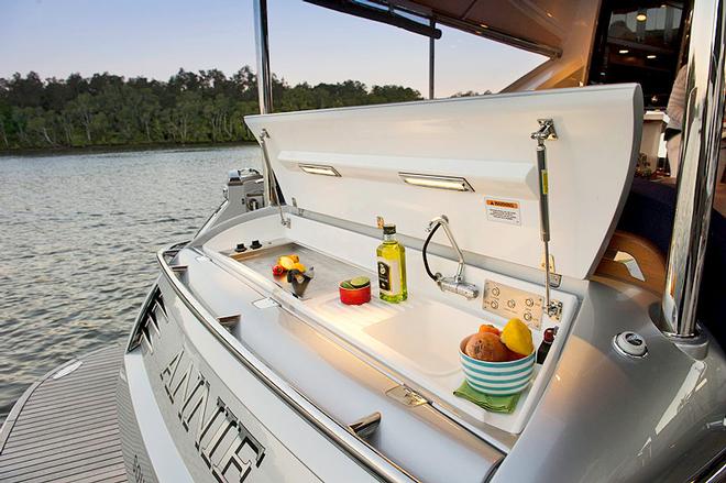 BBQ appears from the coaming of the transom, and is above the tender garage - Belize 54 Daybridge &copy; Riviera . http://www.riviera.com.au
