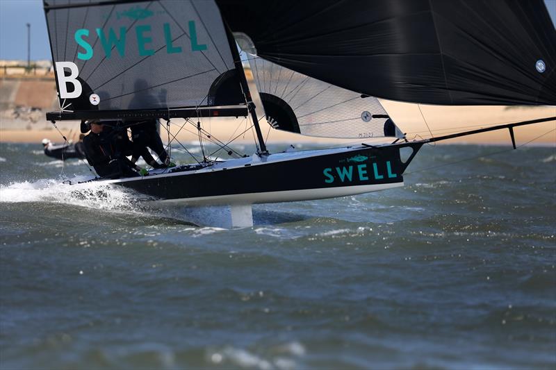 NSW 16ft Skiff Titles Port Hunter - Swell racing leaping a swell photo copyright by Promocean Media taken at Port Hunter 16ft Sailing Club and featuring the 16ft Skiff class