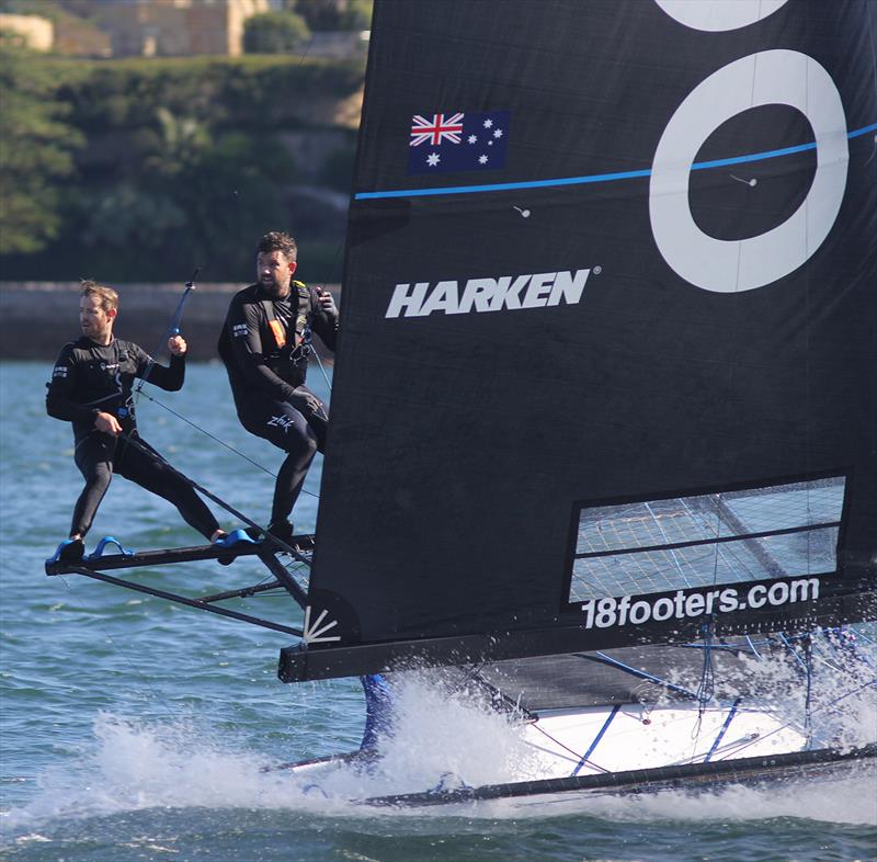 Andoo's winning crew look back at the chasers in Race 7 on 18ft Skiff 73rd JJ Giltinan Championship Day 5 photo copyright Frank Quealey taken at Australian 18 Footers League and featuring the 18ft Skiff class