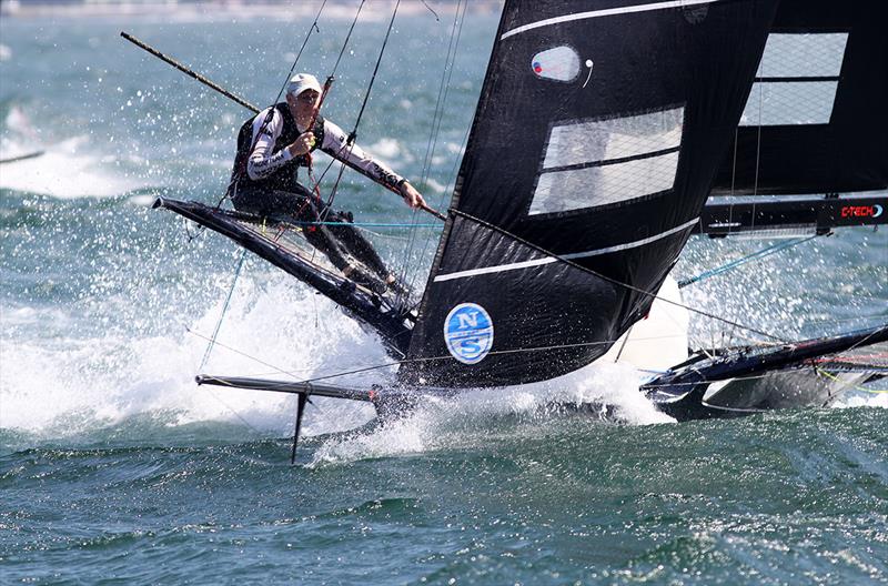 Looks like a one-man crew on an 18 as Simon heads for the bottom mark in a strong southerly wind photo copyright Frank Quealey taken at Australian 18 Footers League and featuring the 18ft Skiff class