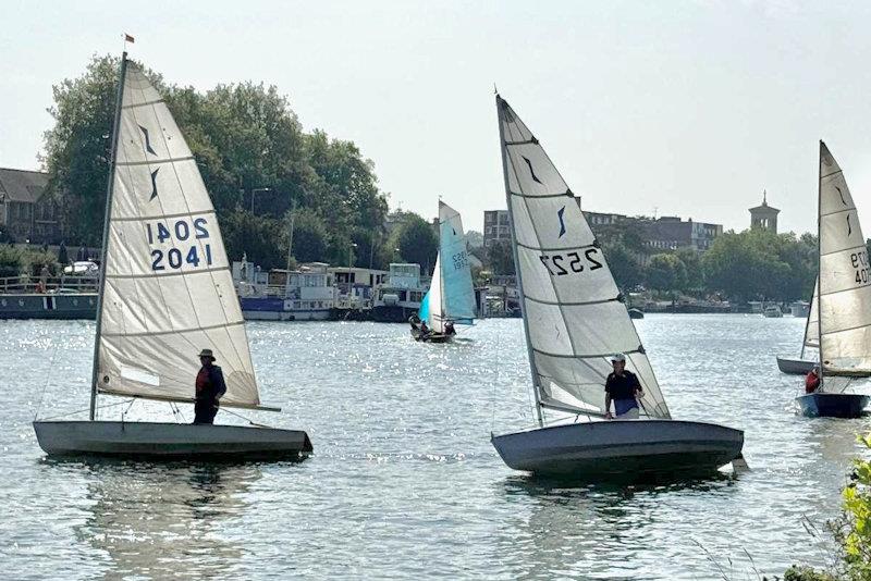 Second-placed John Wilkey (2041) and class winner Nick Titley (2527) silhouetted against the Sunday morning sun - Minima Regatta 2024 photo copyright Eileen Barry taken at Minima Yacht Club and featuring the Solo class